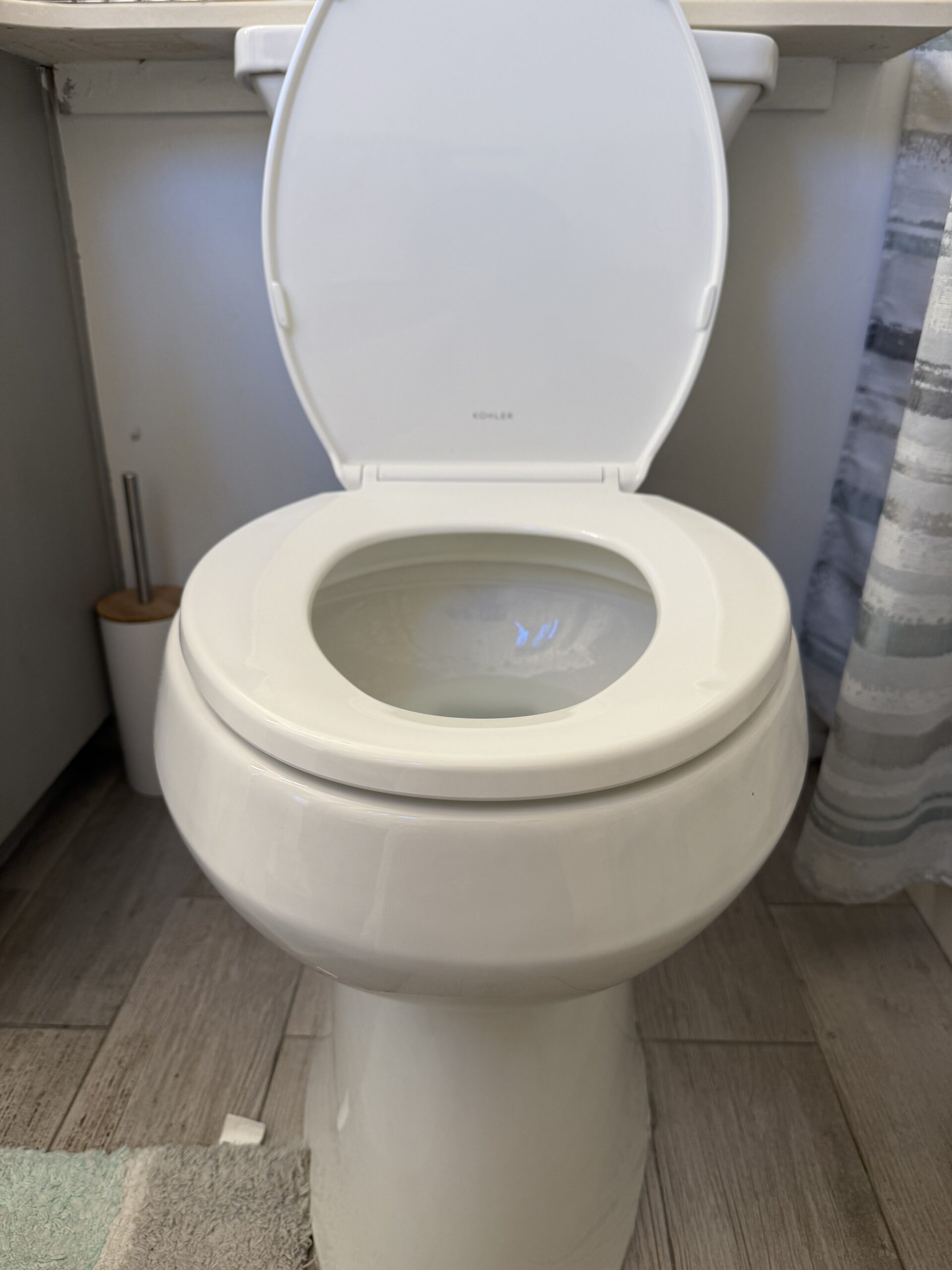 Newly installed modern toilet in a residential bathroom
